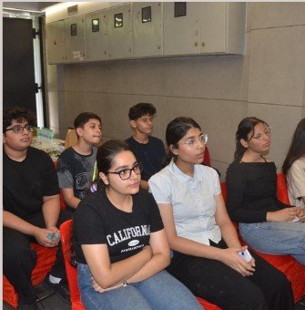 An engaged audience listening during an indoor Digital Decoded masterclass