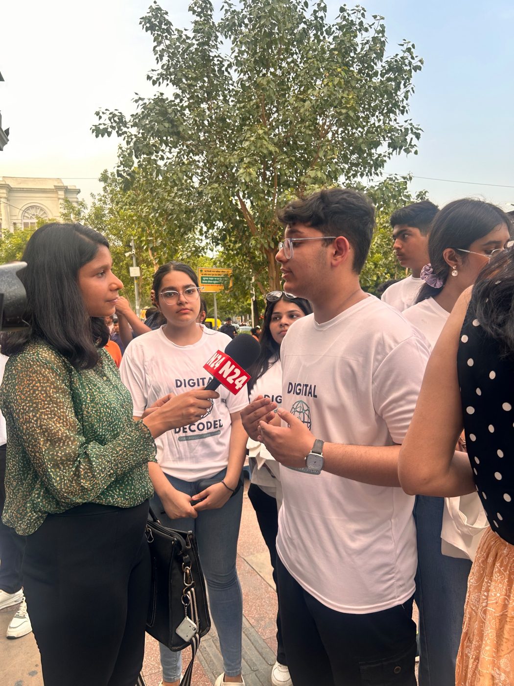 A Digital Decoded member being interviewed by N24 news at a community event