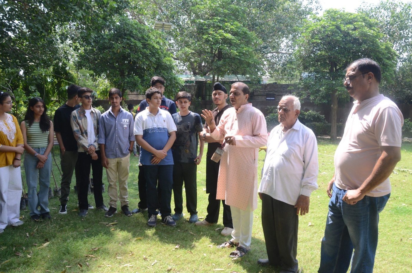Volunteers being briefed ahead of a community tree plantation drive